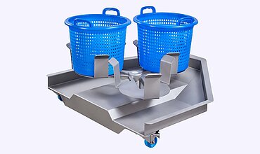 El carrusel de cestas sirve como nexo entre las lavadoras y las centrifugadoras