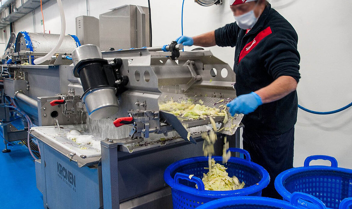 A GEWA washing machine is used to wash salad and vegetables in the Sodexo processing center