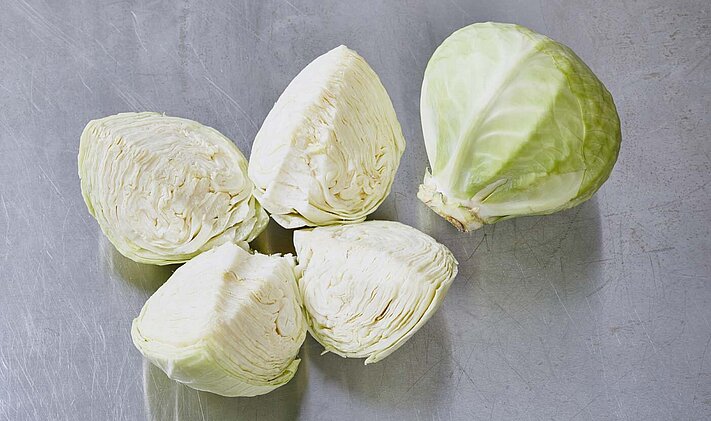 A head of cabbage cored and quartered using the MULTICORER.